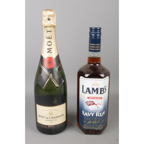 152 - Two bottles of sealed alcohol to include Moet and Chandon Imperial and Lamb's Navy Rum.