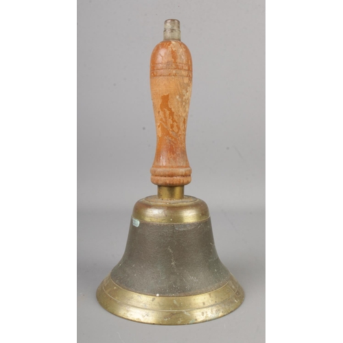 156 - A brass school bell with turned wooden handle.