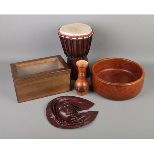 160 - A quantity of mostly wooden wares to include small Djembe drum, vase, glass lidded box, molded leath... 