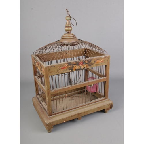 17 - An antique wood and wire work bird cage with painted detailing