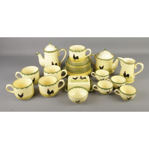 171 - Zeller Fayencerie dinner and tea wares, decorated in cockerels against a yellow ground, with green s... 