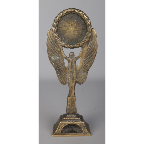 20 - A bronze rugby trophy formed as winged victory raising a copper plaque depicting two rugby players. ... 