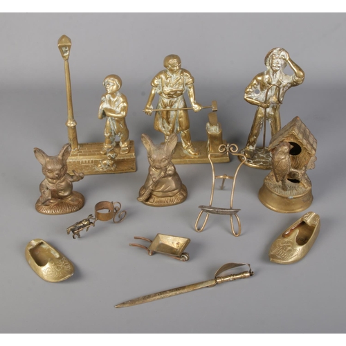 21 - A collection of brass figures to include birdhouse, mice, miners, etc.