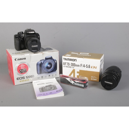 22 - A Canon EOS 1000D digital SLR camera, fitted with 18-55mm lens, together with boxed Tamron AF70-300m... 