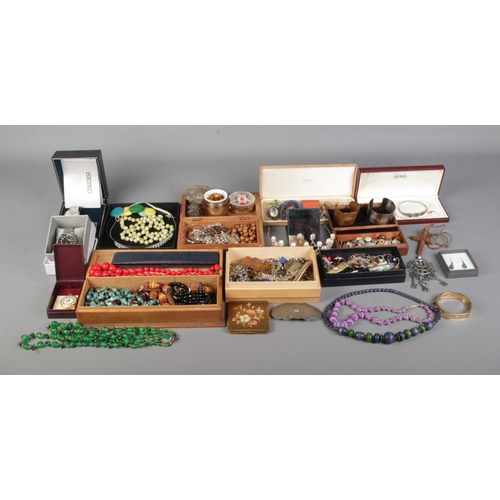 29 - An extremely large collection of costume jewellery and collectables, to include paperweight, bangles... 