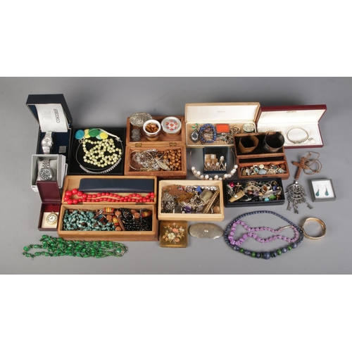 29 - An extremely large collection of costume jewellery and collectables, to include paperweight, bangles... 