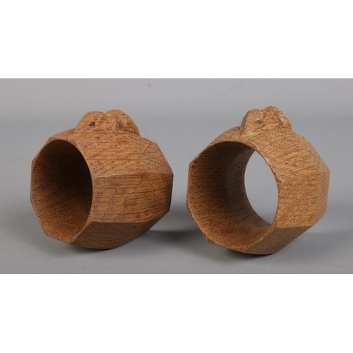 3 - Robert Thompson for Mouseman; a pair of oak napkin rings of octagonal barrel form, bearing signature... 