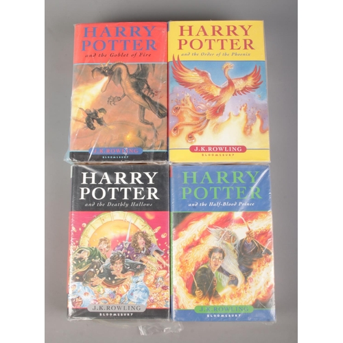 31 - Four hardback Harry Potter First Edition books, by JK Rowling. In protective plastic covers. Consist... 