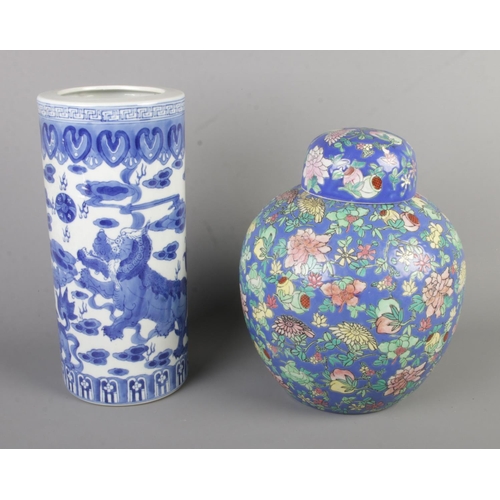 39 - Two pieces of oriental ceramics to include floral lidded vase and blue and white sleeve vase, both b... 