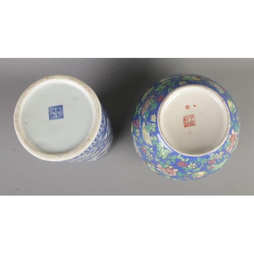 39 - Two pieces of oriental ceramics to include floral lidded vase and blue and white sleeve vase, both b... 