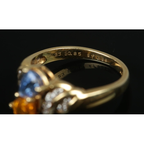 390 - An 18ct Gold Blue and Yellow Sapphire and Diamond ring. Bearing Birmingham import mark and dated for... 