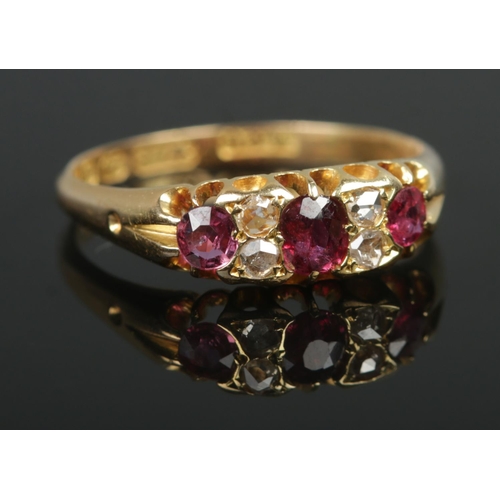 392 - A late Victorian 18ct Gold Ruby and Diamond ring. Assayed Birmingham, 1896. Size O½. Total weight: 3... 