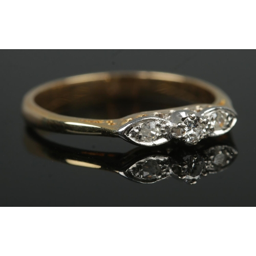 398 - An early Twentieth Century 18ct Gold three stone Diamond ring. Size L½. Total weight: 2.3g.