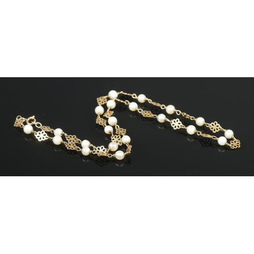 399 - A 9ct Gold floral link necklet, set with cultured pearls. Assayed for London, 1975. Length unclasped... 