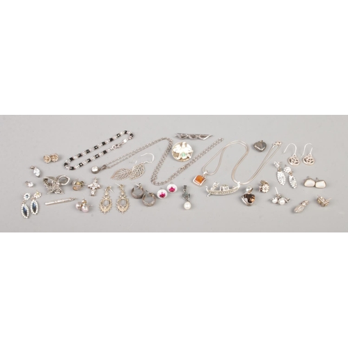 405 - A collection of vintage marked silver jewellery, to include pendants on chain, bracelet, earrings an... 