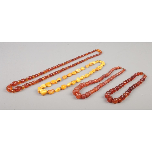 413 - Four string of amber/copal beads, including faceted examples.