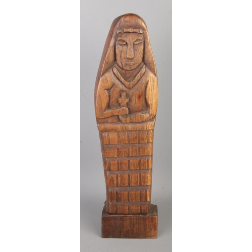 62 - A carved oak religious figure depicting nun praying with crucifix. Approx. height 44.5cm.