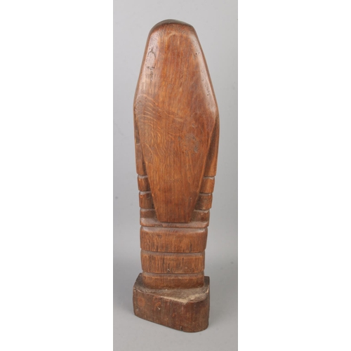 62 - A carved oak religious figure depicting nun praying with crucifix. Approx. height 44.5cm.