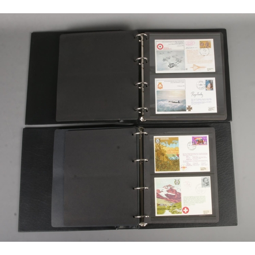 69 - Two albums containing 100 military First day covers to include Flown covers, medal covers, RAF Escap... 