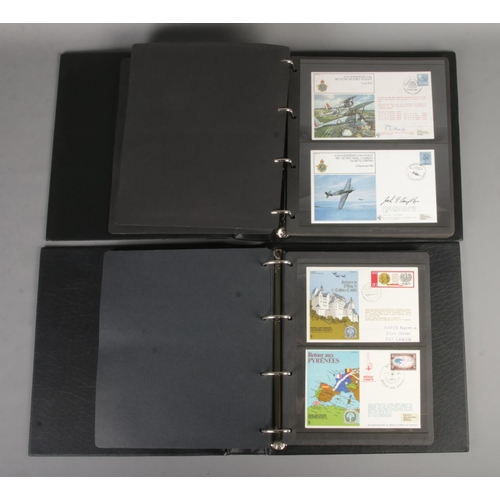 69 - Two albums containing 100 military First day covers to include Flown covers, medal covers, RAF Escap... 