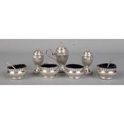 437 - A Victorian silver seven piece cruet set, containing salt and pepper shakers and mustard pots, four ... 