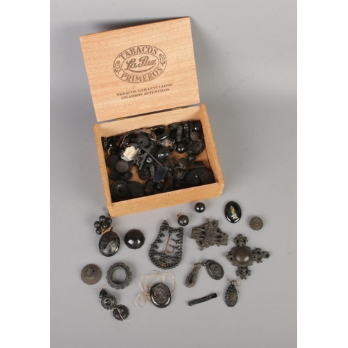 443 - A box of Whitby Jet fragments/oddments to include beads, earrings, brooches, etc. Most pieces are da... 