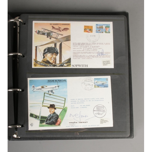 77 - An album containing a good collection of signed RAF first day covers including RAF Historic Aviators... 