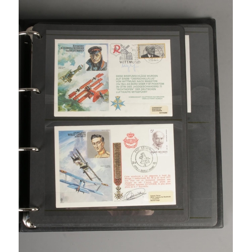 77 - An album containing a good collection of signed RAF first day covers including RAF Historic Aviators... 