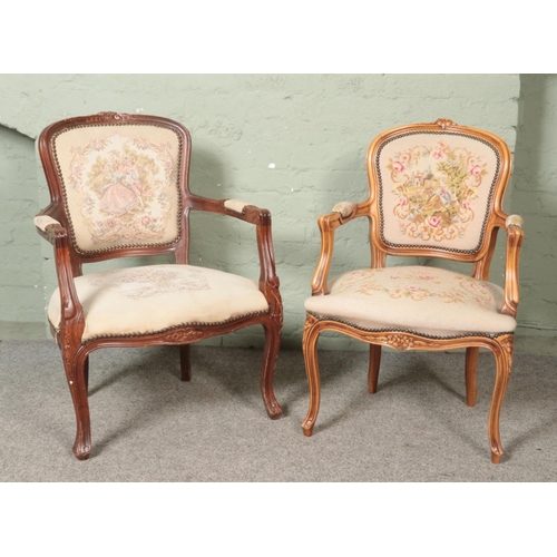 464 - Two French carved and upholstered salon arm chairs.