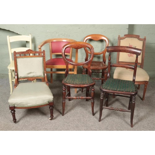 465 - Seven chairs. Includes Edwardian inlaid nursing chair, balloon backs etc.