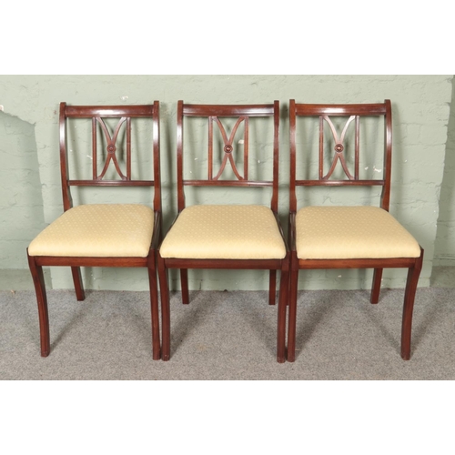 466 - A set of six mahogany dining chairs, including two carvers.