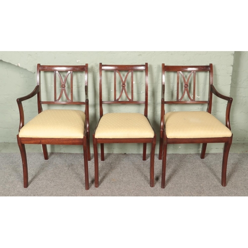 466 - A set of six mahogany dining chairs, including two carvers.