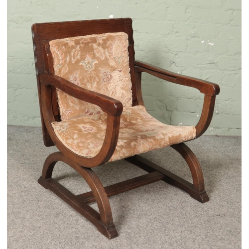 467 - An oak metamorphic arm chair/table.