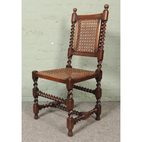 469 - A set of six Druce & Co oak barley twist chairs with canework seats and back supports.