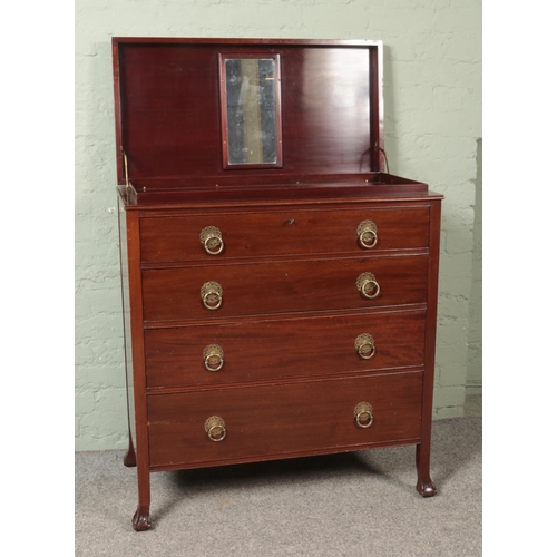 480 - An Edwardian mahogany vanity chest with three drawers and hinged top.