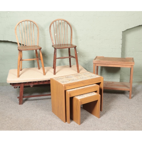 495 - A quantity of assorted furniture, to include garden bench, oak folding card table, two dining chairs... 