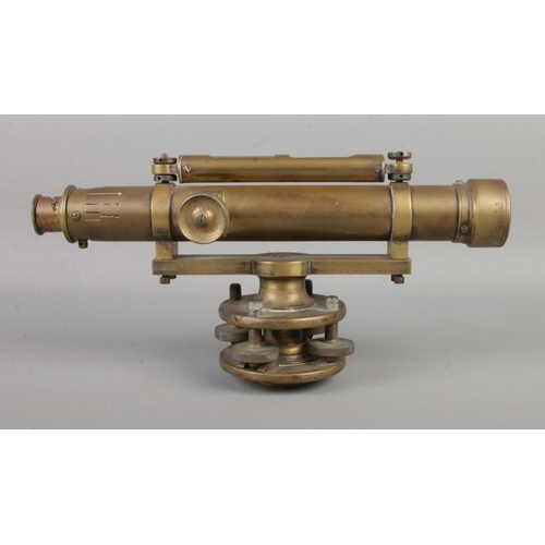 91 - A brass bodied surveyors level, on swivel mount. Marked for T.B Wilson, 21 Grey St. Newcastle on Tyn... 