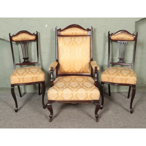 470 - A Victorian carved mahogany three piece salon suite to include upholstered armchair raised on caster... 