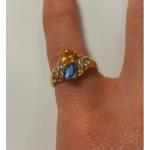 390 - An 18ct Gold Blue and Yellow Sapphire and Diamond ring. Bearing Birmingham import mark and dated for... 