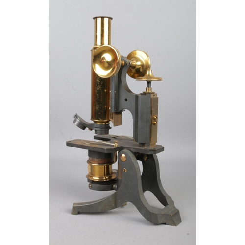 1 - A mahogany cased Negretti & Zambra brass bodied microscope, with adjustable column, lenses and slide... 