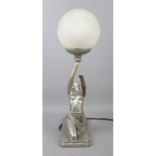 108 - An Art Deco style table lamp formed as a woman with outstretched hands supporting a spherical crackl... 