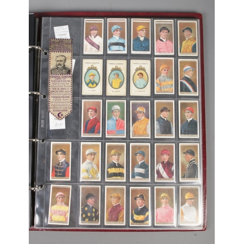 110 - A folder of assorted Sporting cigarette and trade cards to include Wills Cricketer Series 1901, Tadd... 