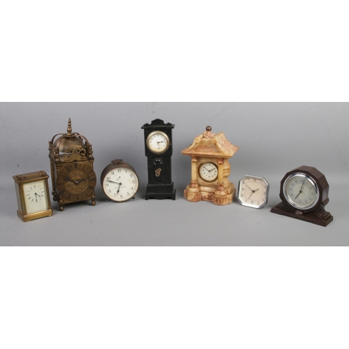 115 - Seven assorted clocks, to include French carriage clock for repair, Mercedes marble temple clock, el... 