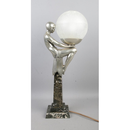 122 - After Max Le Verrier (1891–1973), an Art Deco style table lamp formed as a female figure in a seated... 