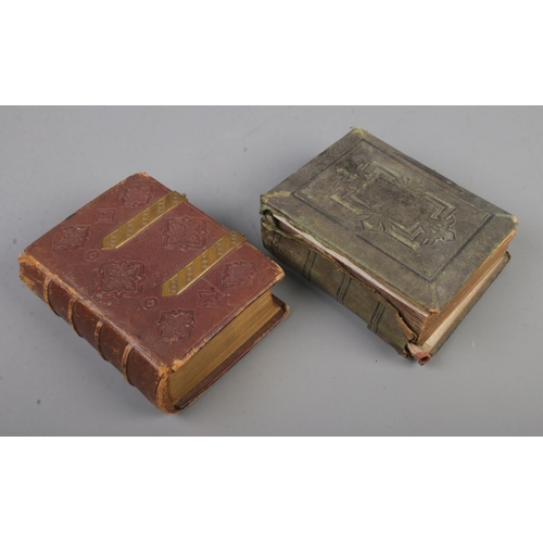 123 - Two Victorian photograph albums with contents of 19th century portraits of men, women and children.