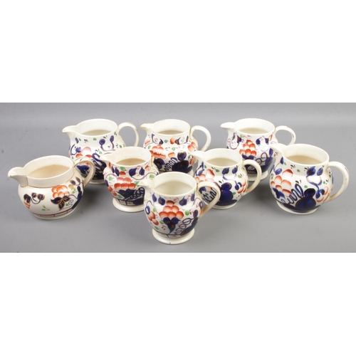 127 - A collection of Gaudy Welsh Oyster pattern jugs, including Allertons.