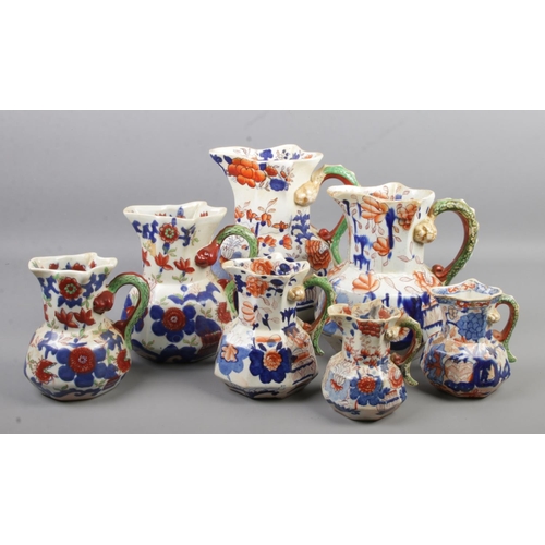 129 - Seven graduated Ironstone 'Japan' jugs. Tallest 22cm.