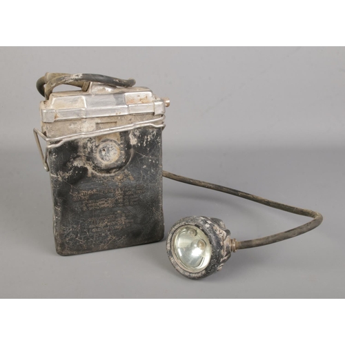 16 - A vintage Oldham and Sons, Manchester miners headlamp featuring Type R battery and Type G lamp.