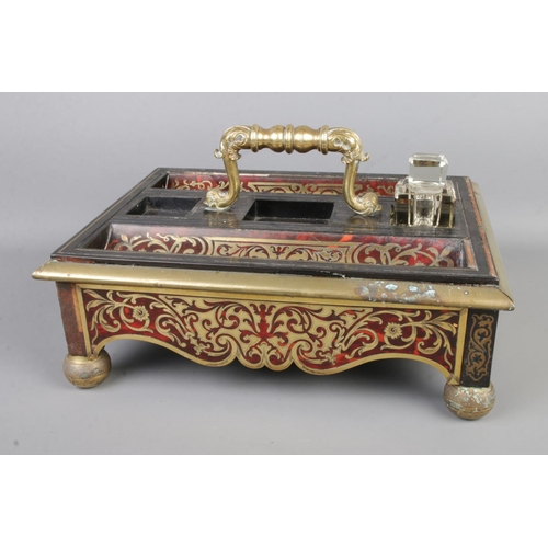 3 - A Boulle work and brass desk tidy featuring single hidden drawer.