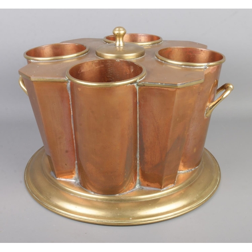 5 - An Art Deco copper and brass twin handled sectional wine cooler of unusual form.